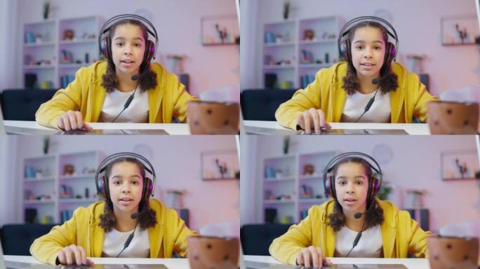 微笑的非洲裔美国少女玩在线视频游戏，休闲