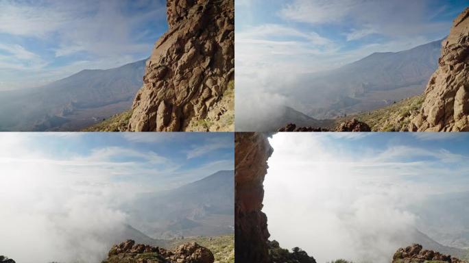 特内里费岛干燥的火山景观。远处的山脉被云彩覆盖