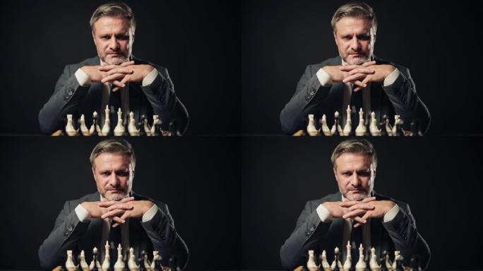 商人下棋看镜头的肖像，成功的策略