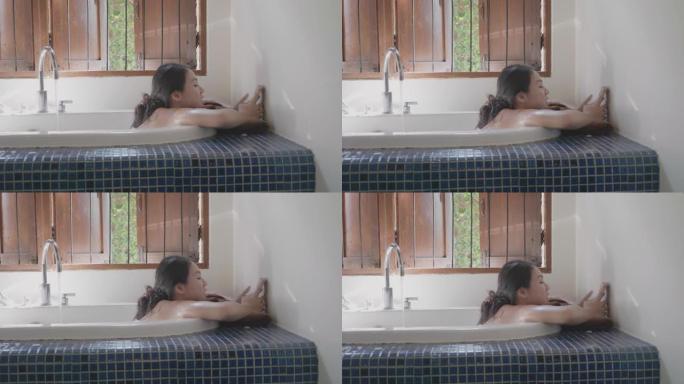 女人躺在浴缸上进行家庭水疗和放松