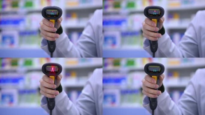 前视图特写条形码阅读器在女性手中，红灯闪烁。无法识别的女药剂师在药店慢动作扫描二维码。