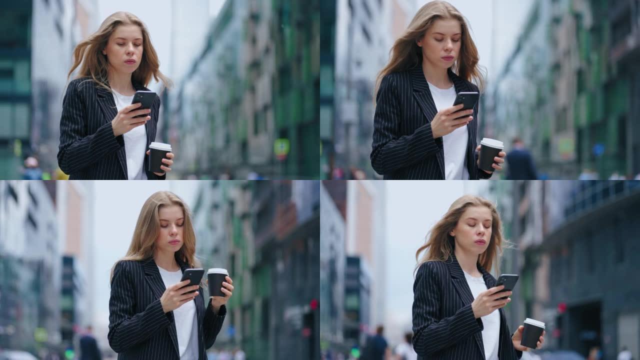 自信和雄心勃勃的女人穿着西装走在市中心，看着智能手机屏幕