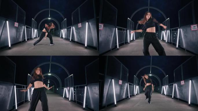 嘻哈舞者女人正在黑暗的隧道中表演现代舞蹈和充满活力的舞蹈