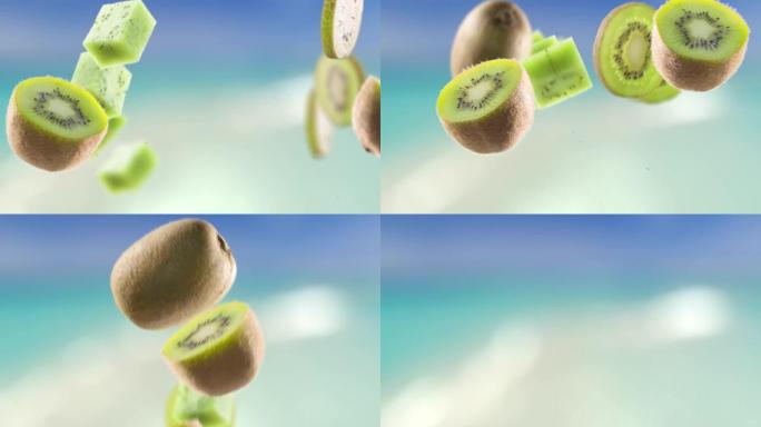 在海滩背景下飞行猕猴桃和切片