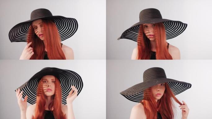 美丽诱人的红发女人用相机调情。戴着大而优雅的帽子摆姿势，遮住她的脸