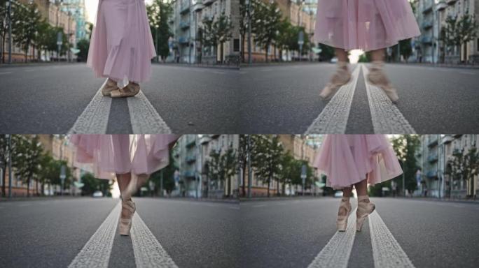 穿着足尖鞋的芭蕾舞女演员的腿在隆隆的条纹上跳舞