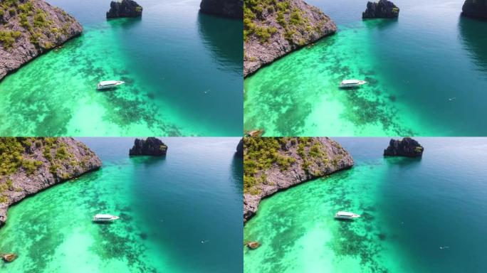 俯视图无人机拍摄的观光船带游客在海中看到珊瑚翡翠热带海
