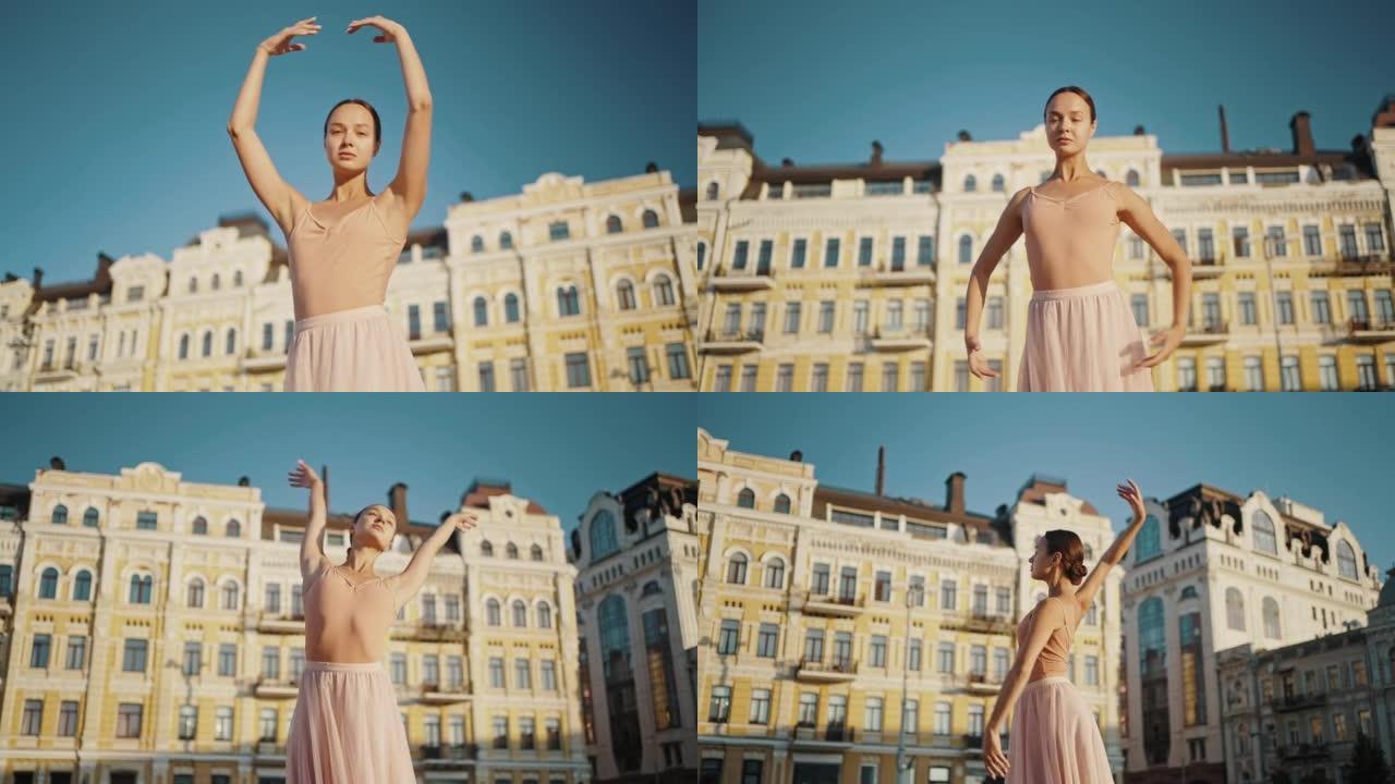 优雅的芭蕾舞演员在城市举起双手进行舞蹈动作