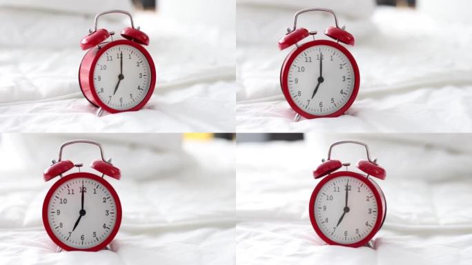 早上七点的红色闹钟站在白色床上