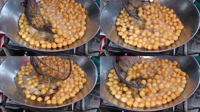 烹饪红薯球或泰语叫Khanom khai nok kratha。由红薯和面粉制成的模具球