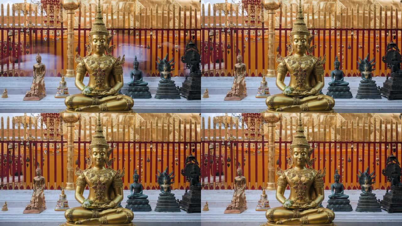 在泰国清迈的土素贴寺，佛教信徒在主塔周围散步，前景是一尊安详的佛像
