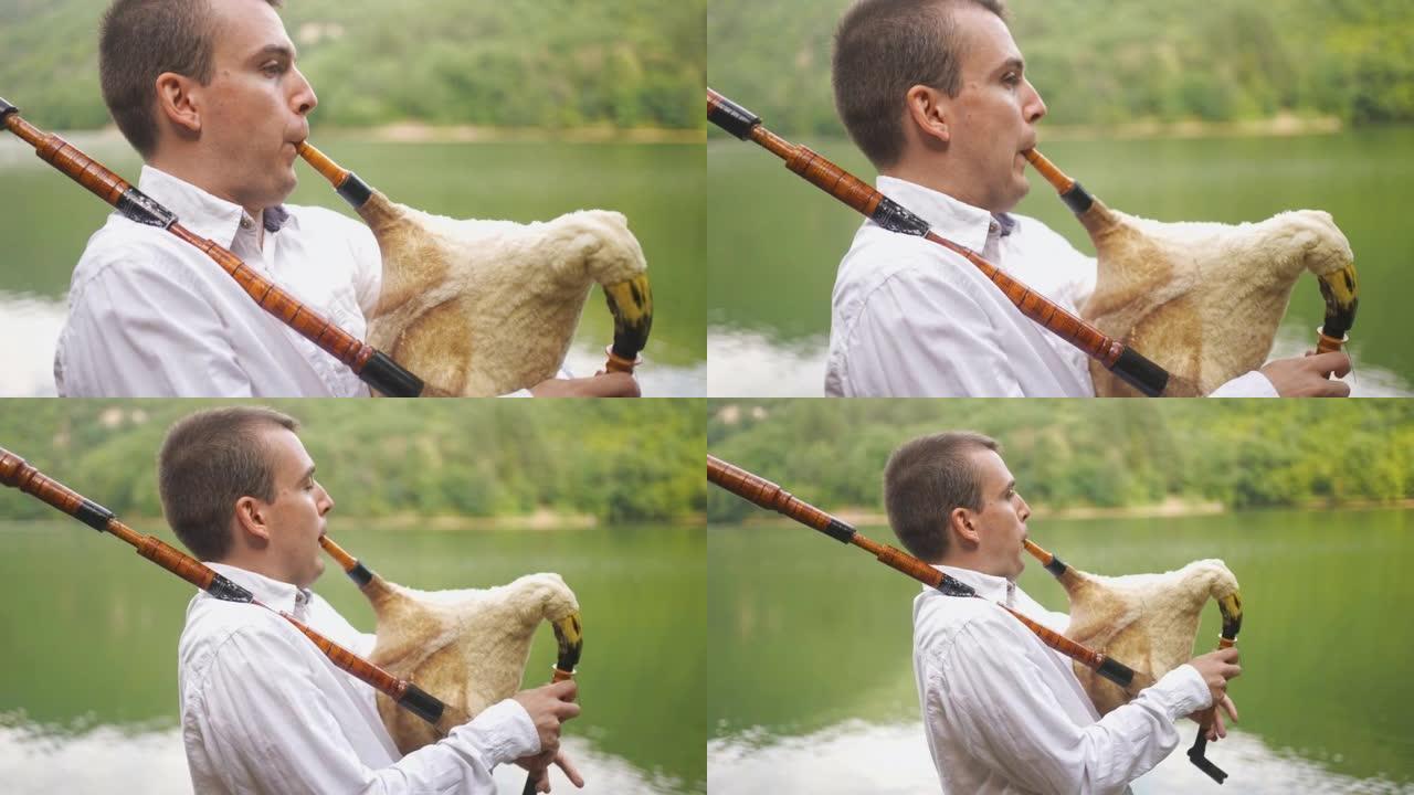 男民谣音乐家利用湖畔度假提升风笛演奏技巧