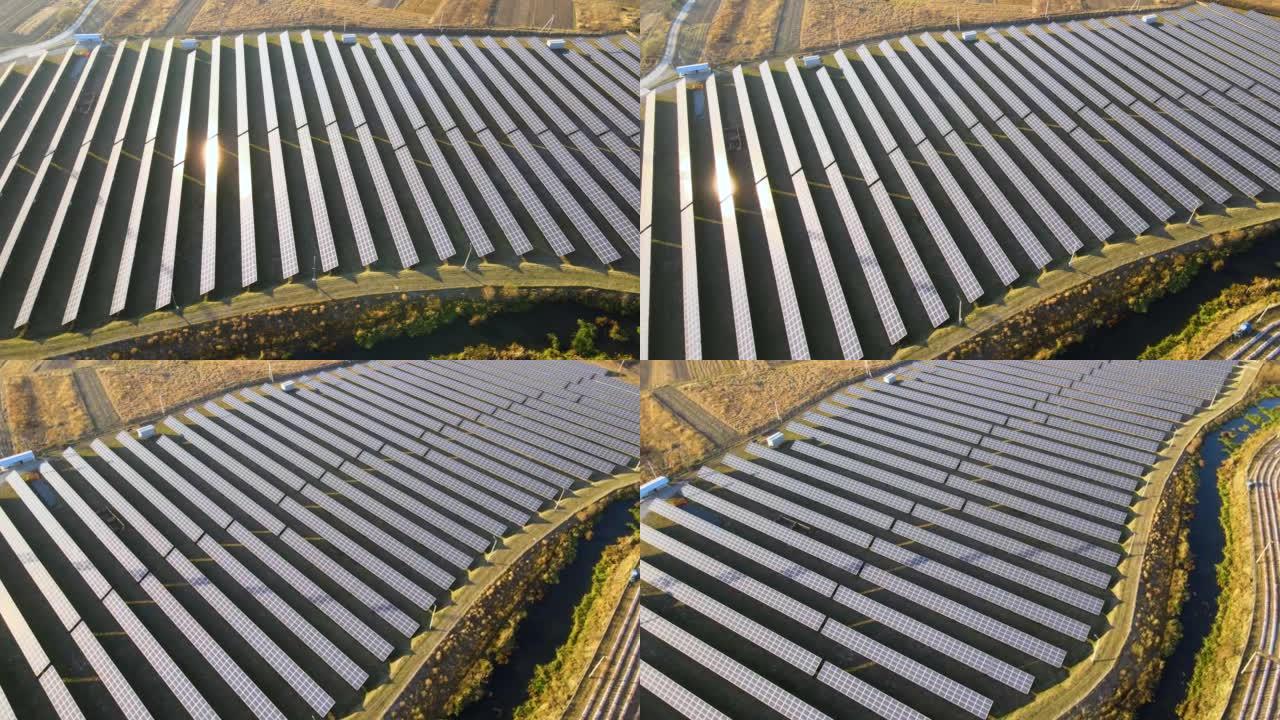 大型可持续发电厂的鸟瞰图，带有成排的太阳能光伏板，用于生产清洁的生态电能。零排放概念的可再生电力