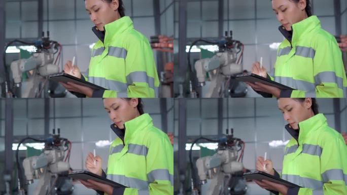 自动化工厂女工程师修理工业机器人特写视频