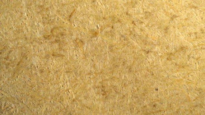 纤维板壁表面的幻灯片。作为移动背景的木质表面的宏观多莉纹理。