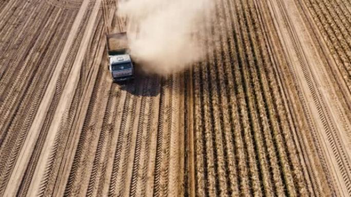 Harvesting of potatoes on agricultural land.