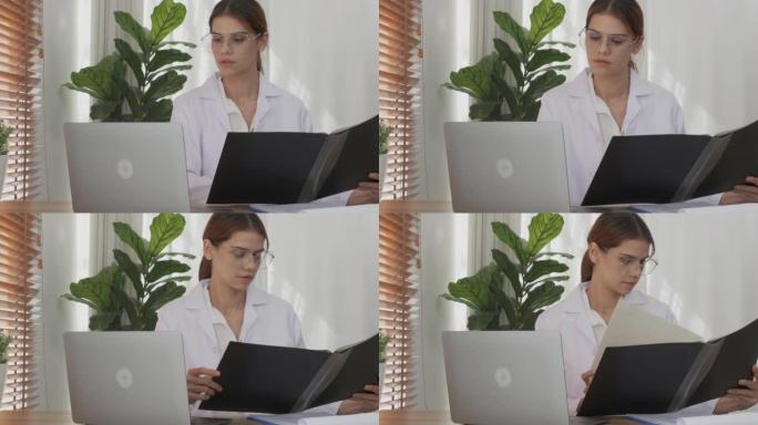 年轻的女医生在诊所的剪贴板上看病人疾病的文件文件夹，女性在医院检查的报告文件，一个人，医疗概念。
