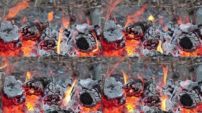 石炉中的木炭燃烧-特写明亮的火焰燃烧在石炉内的木炭上