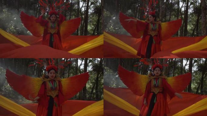 身着红鸟服装的中国美女，背景为红色和橙色面料