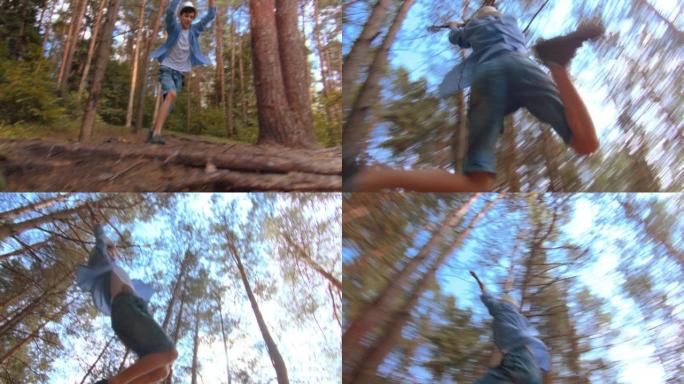 快乐的少年男孩在森林里蹦极，在蓝天下，男孩在森林里玩得开心