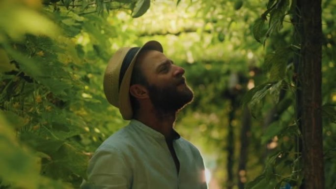 Organic gardening. Smiling caucasian farmer in a s