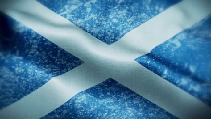 4K暴风雪/雪在苏格兰旗帜股票视频。冷淡的苏格兰国旗。旋转/旋转的冰晶。雪花掠过苏格兰国旗。