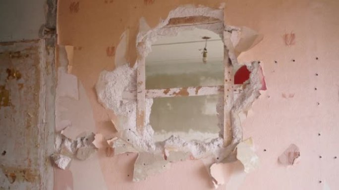 Contractor wrecks wall with sledgehammer making ho