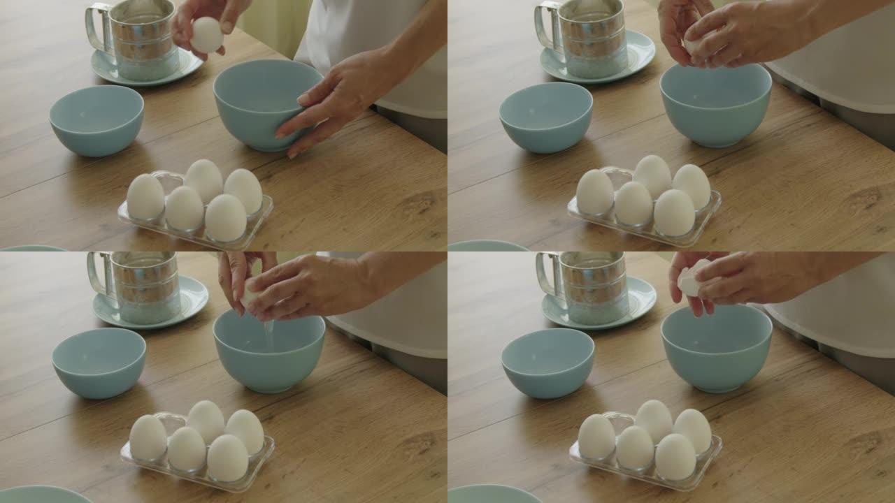 女人把鸡蛋扔进碗里。
