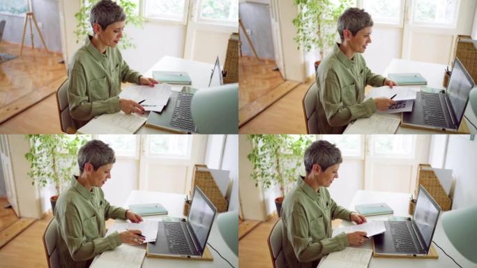 Businesswoman doing a video call at home using lap