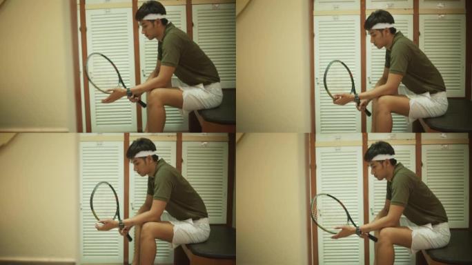 男子打网球前做好准备