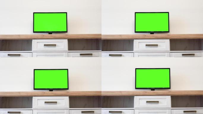 用于广告的色度键屏幕。客厅空白绿色背景液晶智能电视屏幕