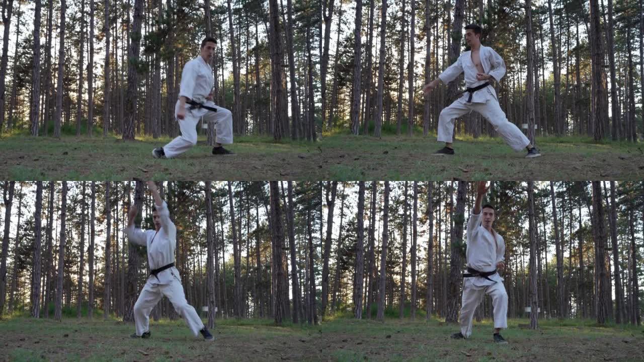 男子在森林里训练空手道一名男运动员karateka高加索练习者白天在森林里做自然的卡塔真正的人