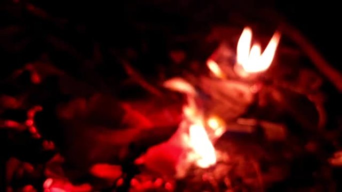 Defocus footage of red orange flame fire dried lea
