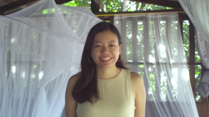 Portrait of Asian woman in homestay with smile and