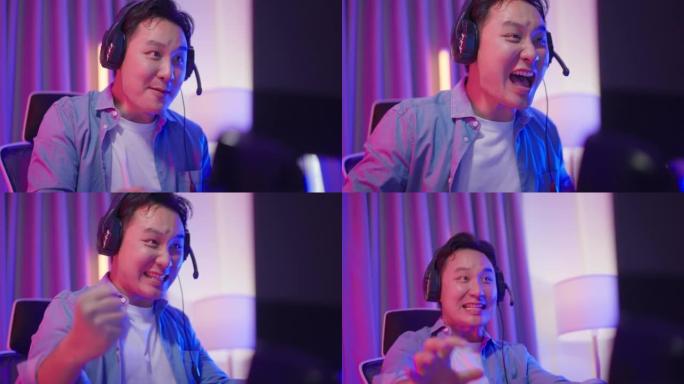 亚洲有吸引力的电子竞技男玩家在电脑上玩在线视频游戏。帅哥游戏玩家感到快乐和兴奋，在家玩网络锦标赛时享