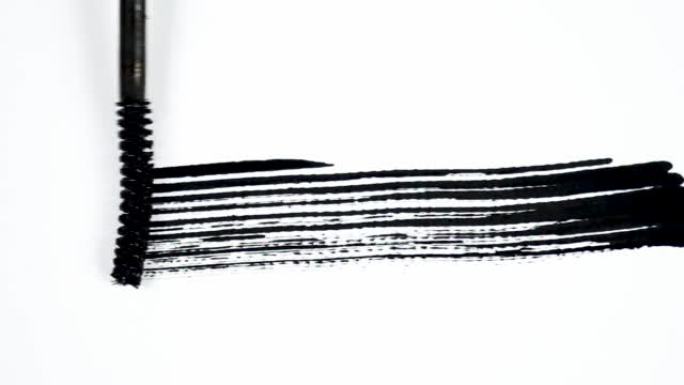 镜头元素叠加的黑线笔触。动画手用黑色墨水刮睫毛膏，用于下三分之一和过渡。