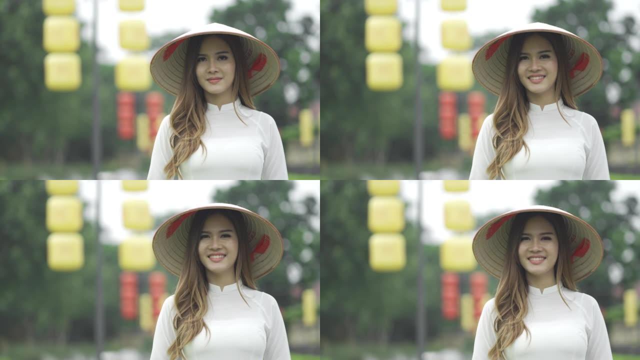 越南女性穿着传统服装和亚洲风格圆锥形帽子的肖像