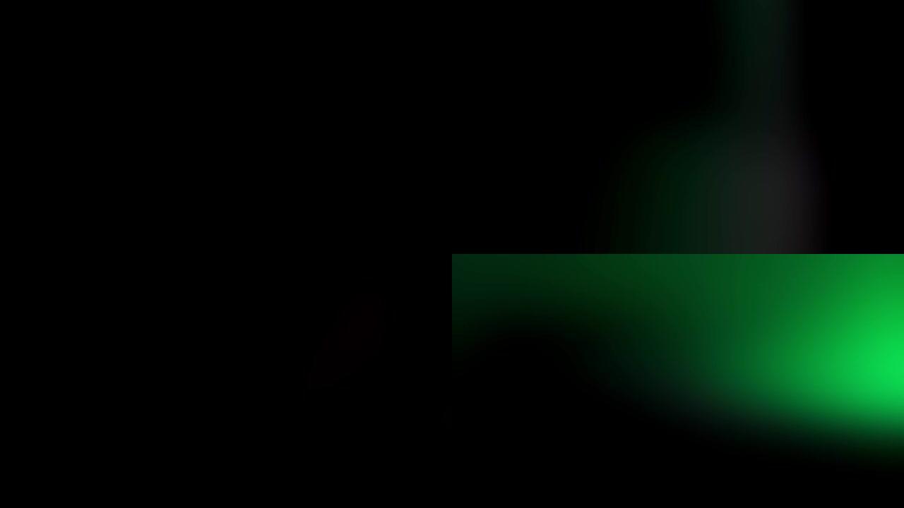 霓虹灯红色和绿色光泄漏效果背景。4k实拍。