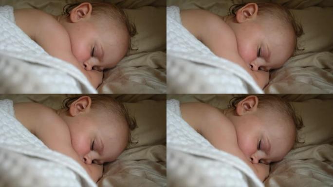和平可爱的婴儿睡在家里的床上。睡眠新生儿概念。一岁的女婴在家庭室内背景下安静地睡觉。宁静的梦。脸特写