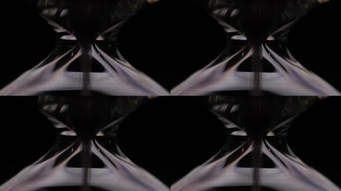 黑暗背景上的沙漏特写