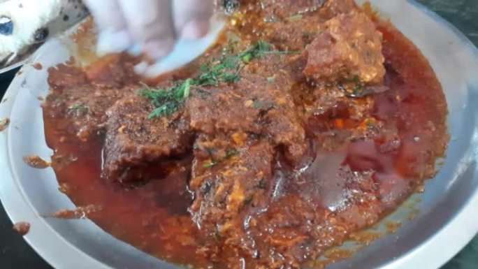 Bhuna Gosht羊肉masala或印度羊肉咖喱是正宗的印度辣羊肉肉汁菜肴。用印度香料烹制，在钢