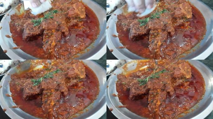 Bhuna Gosht羊肉masala或印度羊肉咖喱是正宗的印度辣羊肉肉汁菜肴。用印度香料烹制，在钢
