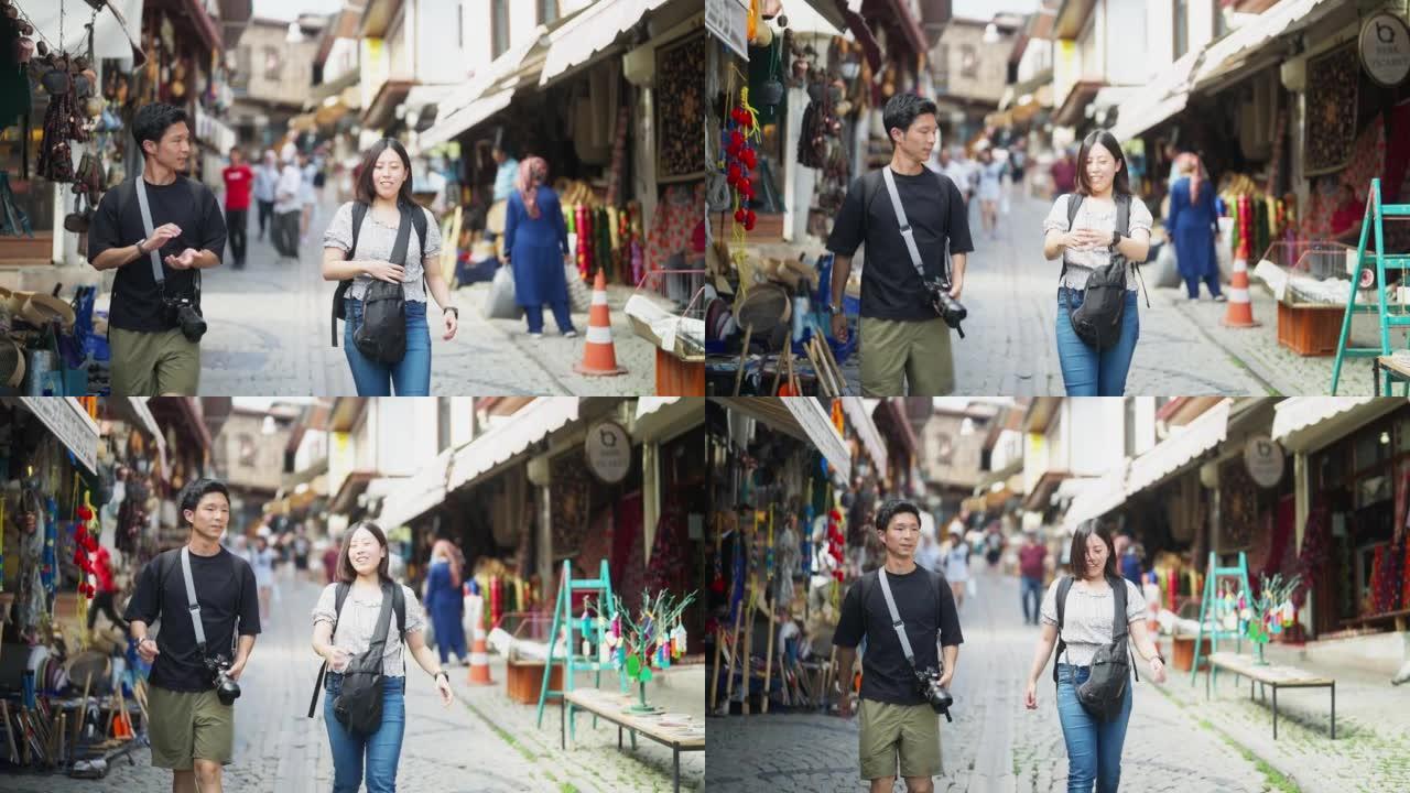 Young tourist couple walking in historical town an