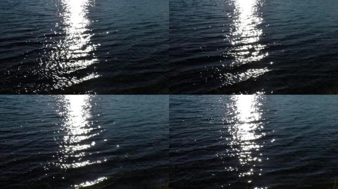 星星和眩光从水面上的太阳路径上的海浪。