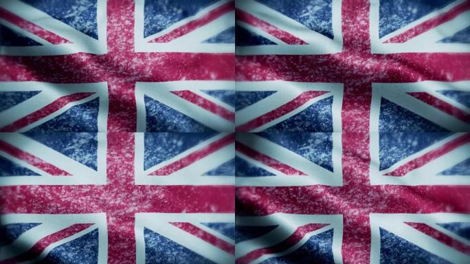 4K暴风雪/雪在英国国旗股票视频。冷淡的英国国旗。旋转/旋转的冰晶。雪花掠过英国国旗。
