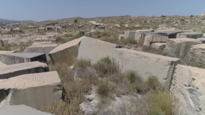 Drone flight over old abandoned quarry in the dese