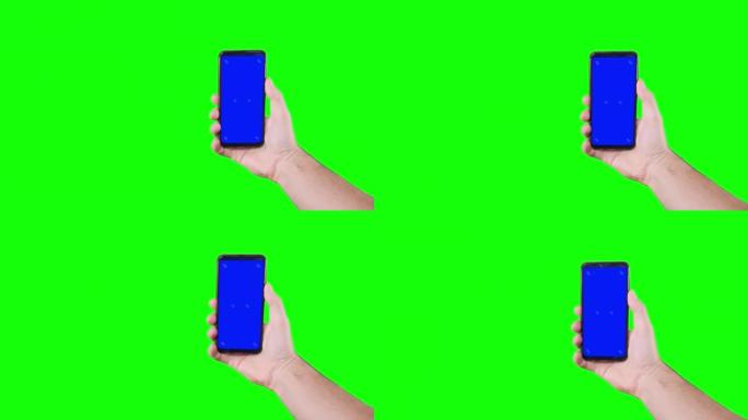 男性手持智能手机，蓝屏，绿色背景标记