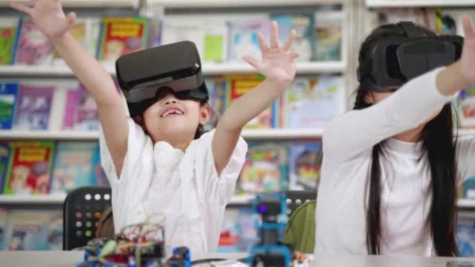 在课堂上，孩子们戴着vr眼镜学习看3D虚拟现实。