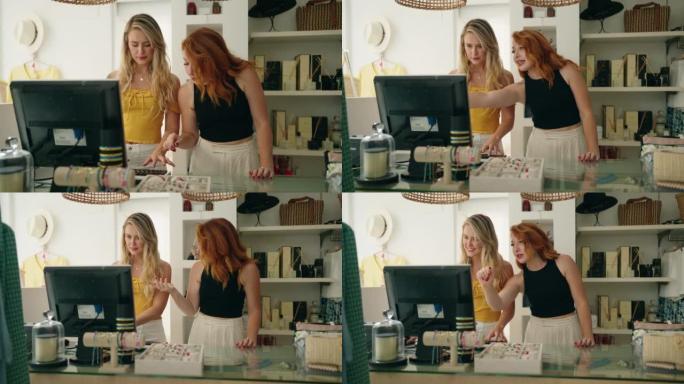 Two women shop employees using computer working at