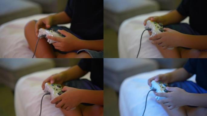 亚洲男孩在卧室里用控制器玩电子游戏